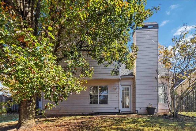 a view of a house with a tree