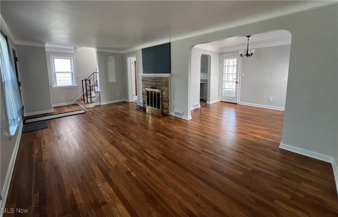 4236 Ridgeview Road Cleveland, OH 44144 - Photo 3 of 22 Living room with a stone fireplace and refinished hardwood flooring.