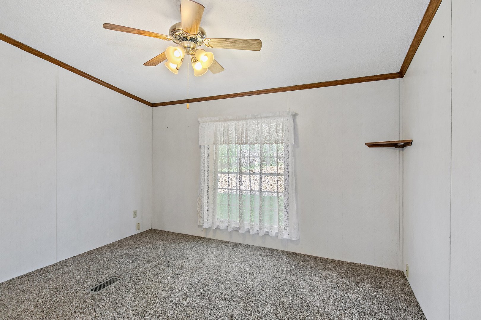 8566 Fig Tree Lane Roscoe, IL 61073 - Photo 11 of 14 an empty room with windows and fan