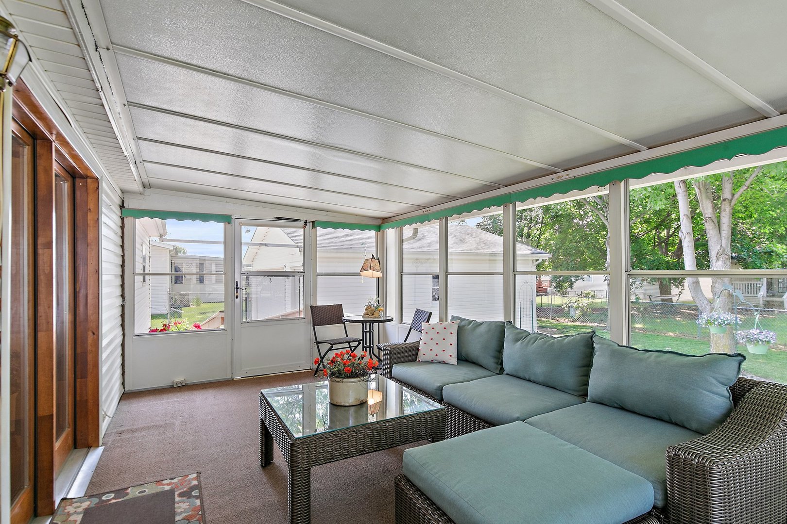 8566 Fig Tree Lane Roscoe, IL 61073 - Photo 12 of 14 a living room with furniture and floor to ceiling windows
