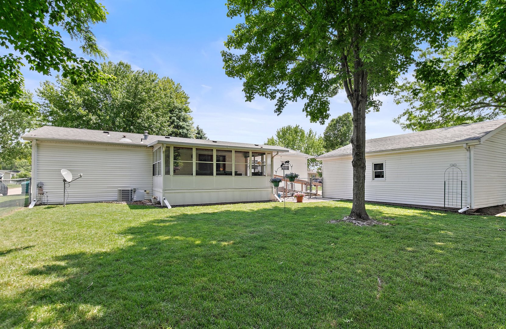 8566 Fig Tree Lane Roscoe, IL 61073 - Photo 14 of 14 a backyard of a house with table and chairs