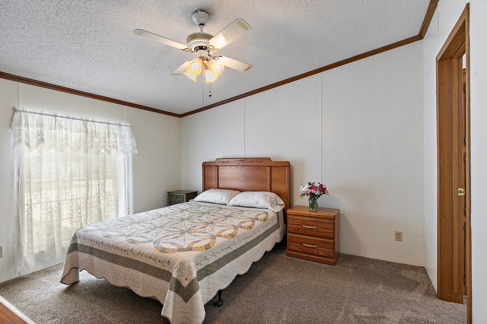 8566 Fig Tree Lane Roscoe, IL 61073 - Photo 6 of 14 a bedroom with a bed and a chandelier