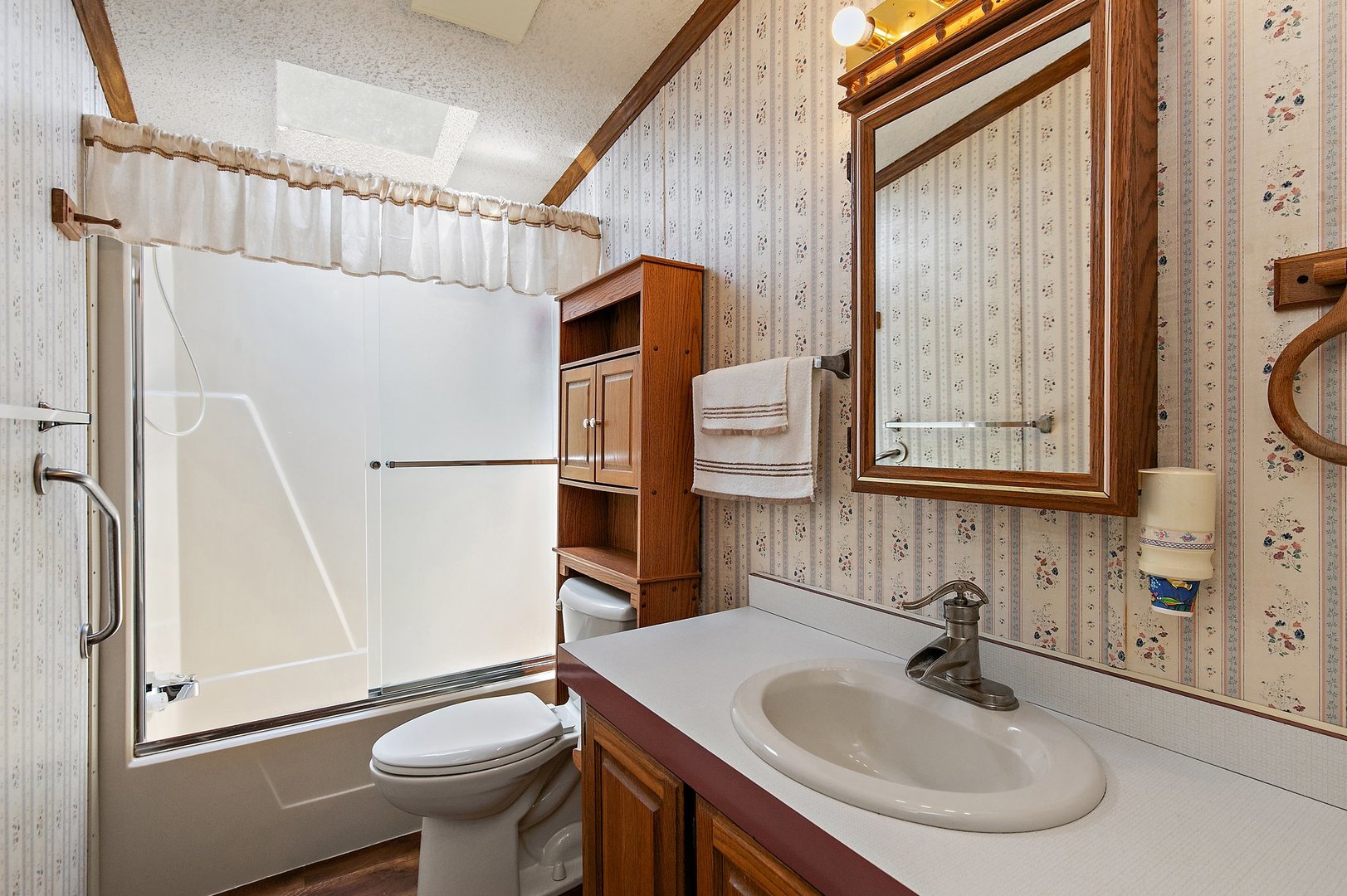 8566 Fig Tree Lane Roscoe, IL 61073 - Photo 9 of 14 a bathroom with a sink toilet and mirror
