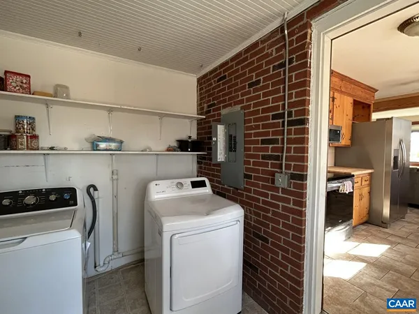 a view of a storage & utility room with washer and dryer