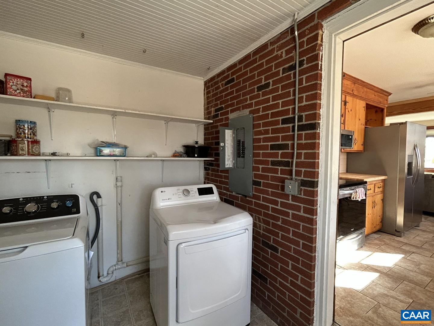 7714 Blenheim Road Scottsville, VA 24590 - Photo 14 of 35 a view of a storage & utility room with washer and dryer