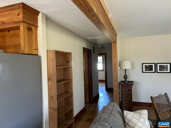 a view of a livingroom with furniture and wooden floor