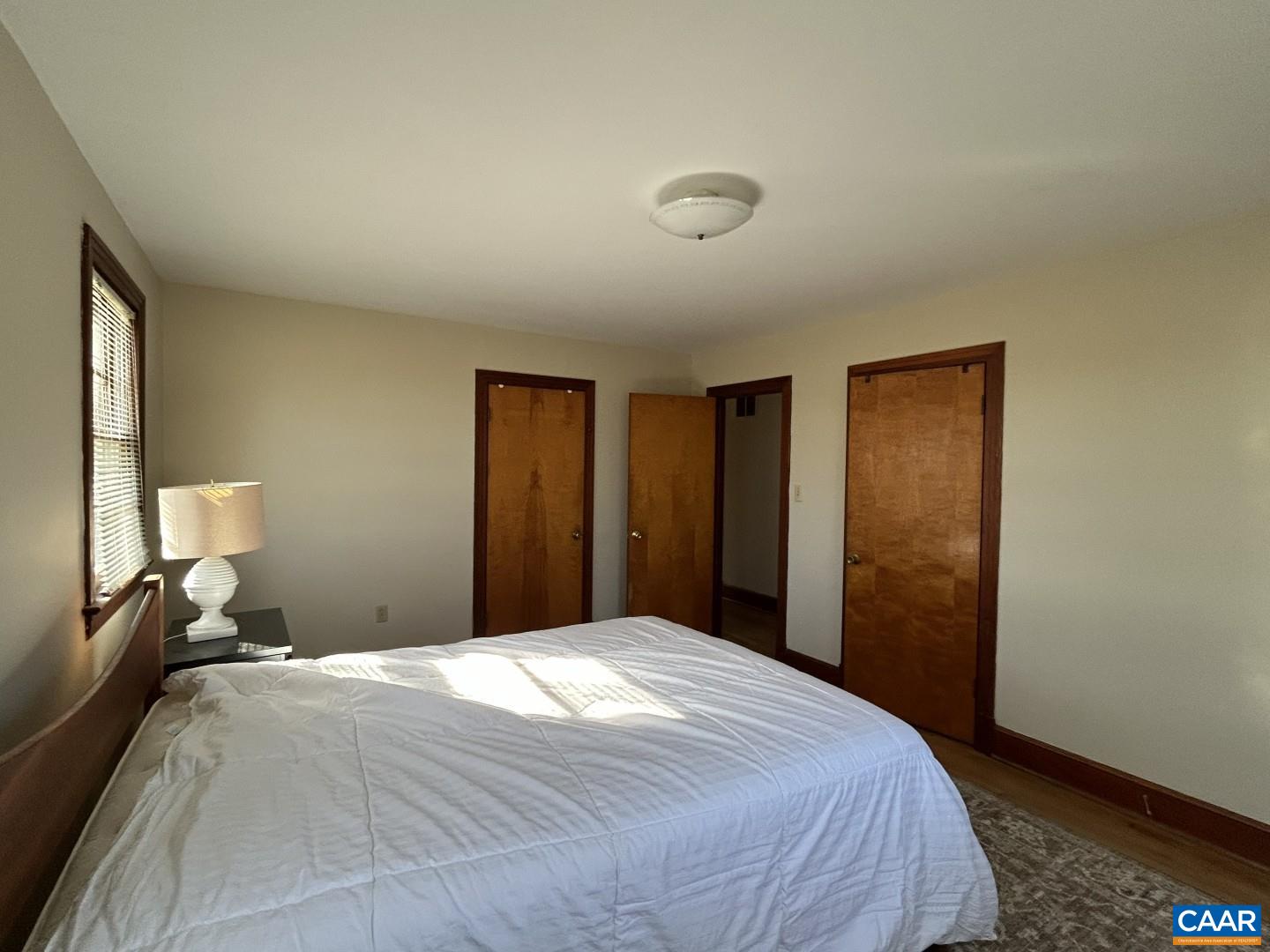 7714 Blenheim Road Scottsville, VA 24590 - Photo 20 of 35 a bedroom with a bed and a mirror