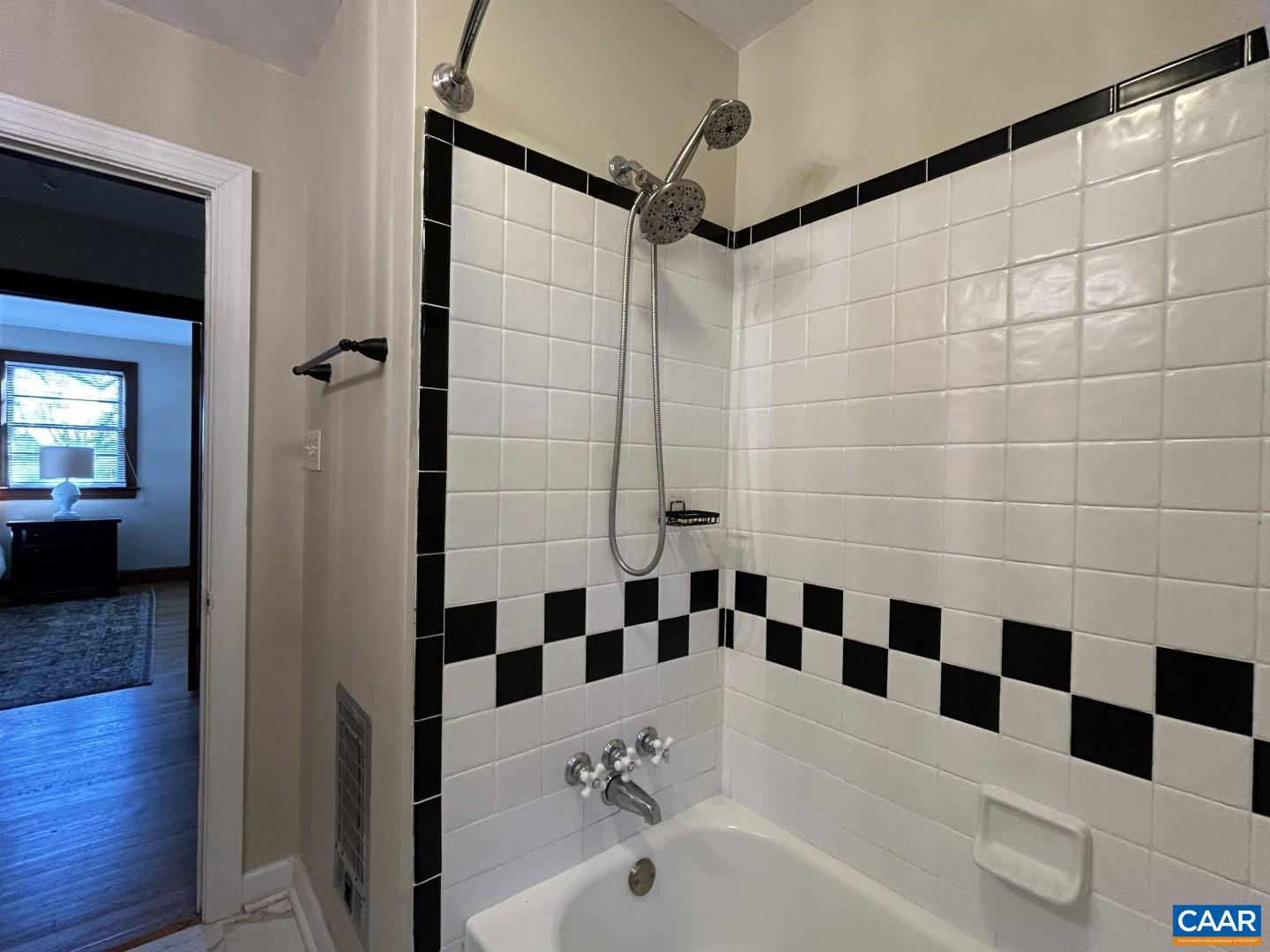 7714 Blenheim Road Scottsville, VA 24590 - Photo 22 of 35 a bathroom with a black and white checkered floor