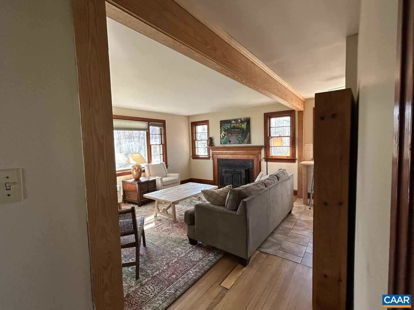 7714 Blenheim Road Scottsville, VA 24590 - Photo 23 of 35 a living room with furniture and a fireplace