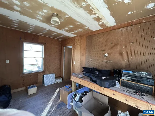 a room with furniture and wooden floor