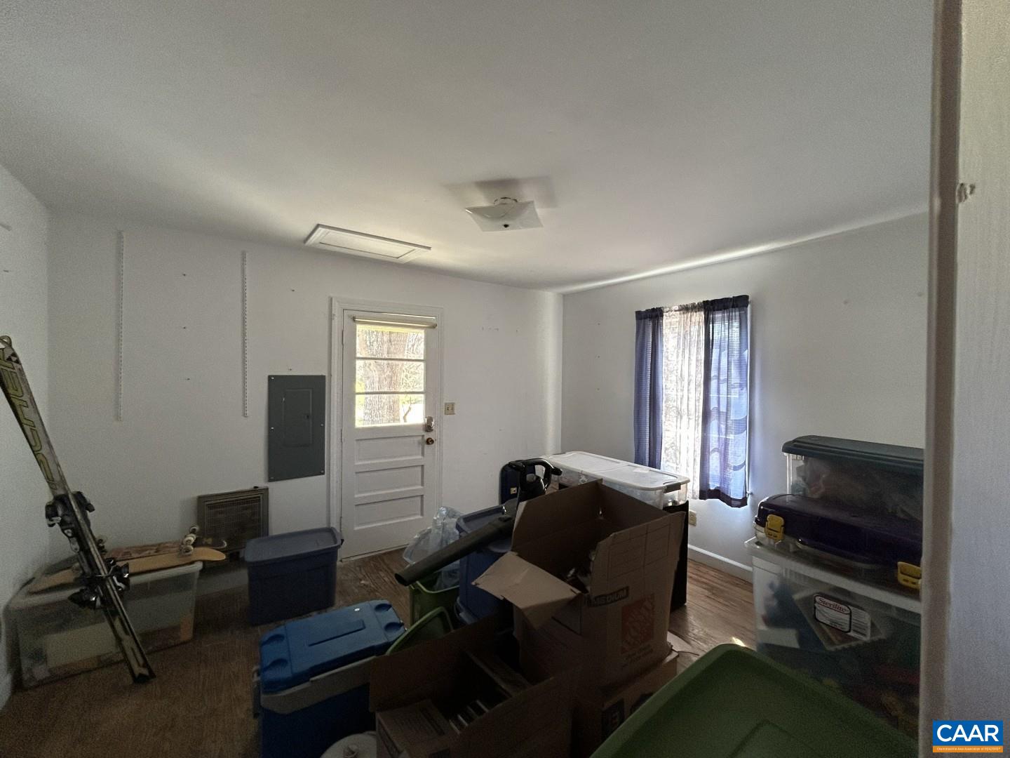 7714 Blenheim Road Scottsville, VA 24590 - Photo 28 of 35 a living room with furniture a flat screen tv and a window