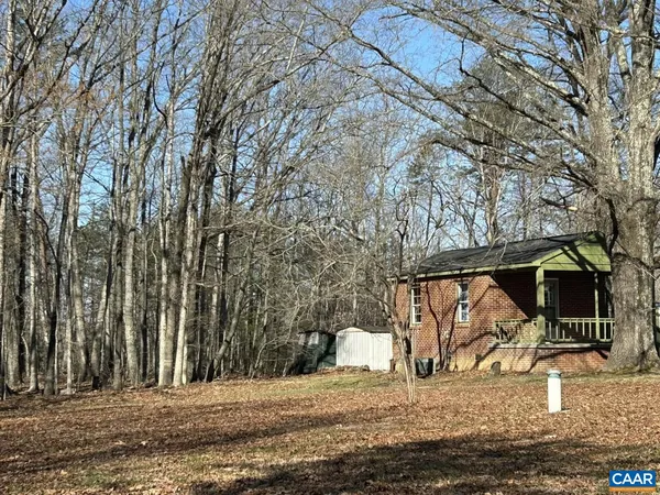 a view of outdoor space with deck and kitchen