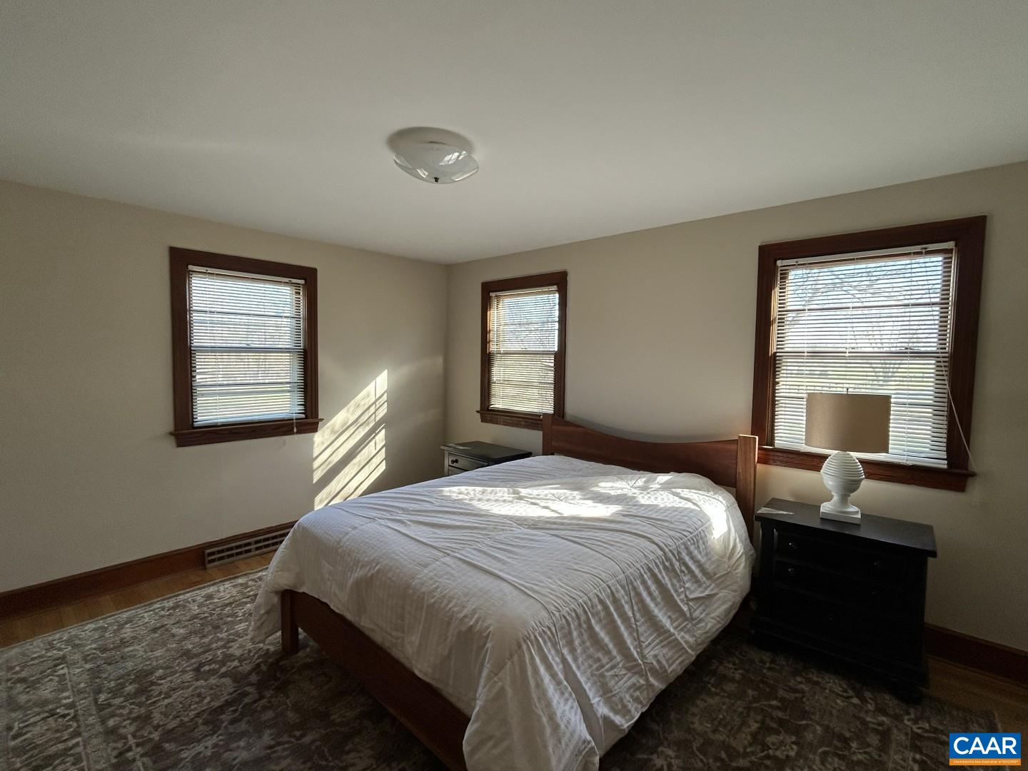 7714 Blenheim Road Scottsville, VA 24590 - Photo 5 of 35 a bedroom with a bed and with windows