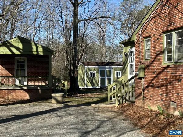 a view of a house with a tree