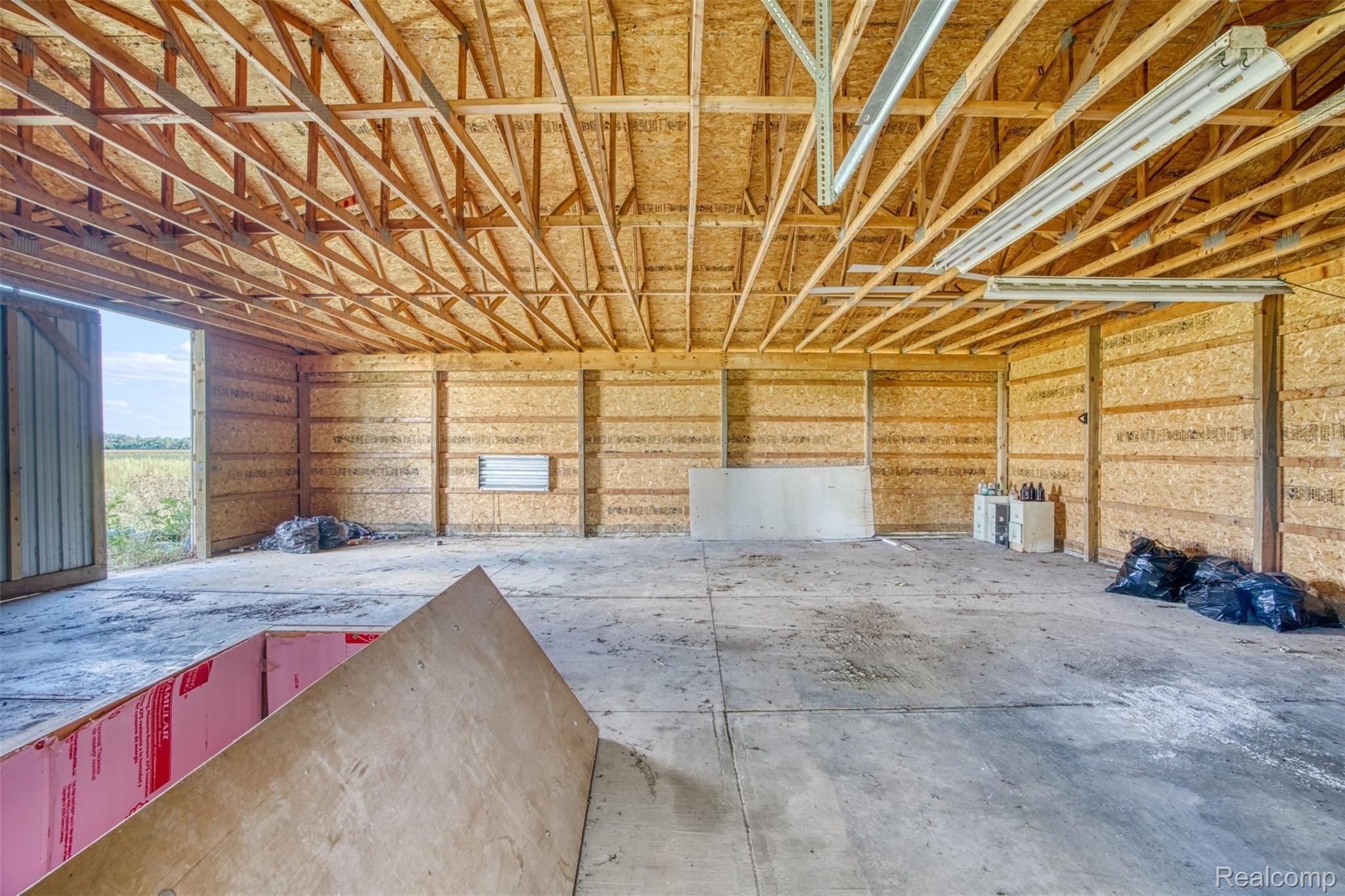 2980 Baseline Road Stockbridge, MI 49285 - Photo 8 of 28 2015 Outbuilding with concrete floors.