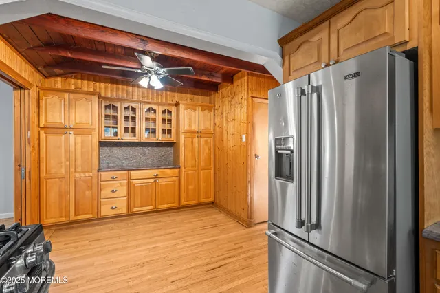 a kitchen with stainless steel appliances granite countertop a stove and a refrigerator