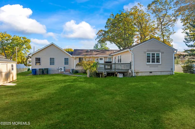 a front view of a house with a yard table and chairs