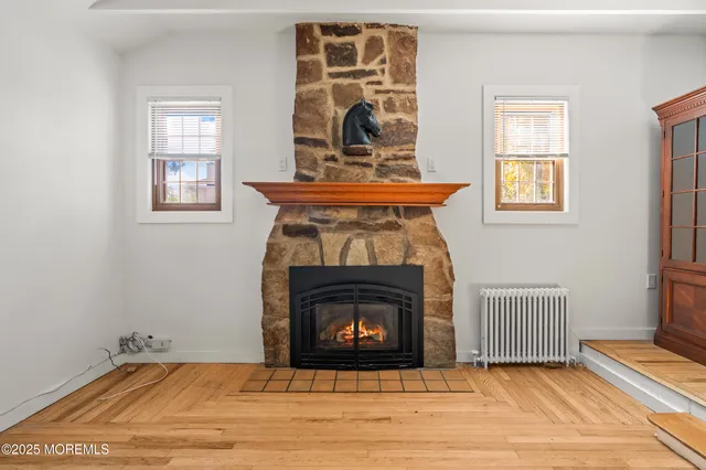 a view of a kitchen with a sink and a refrigerator