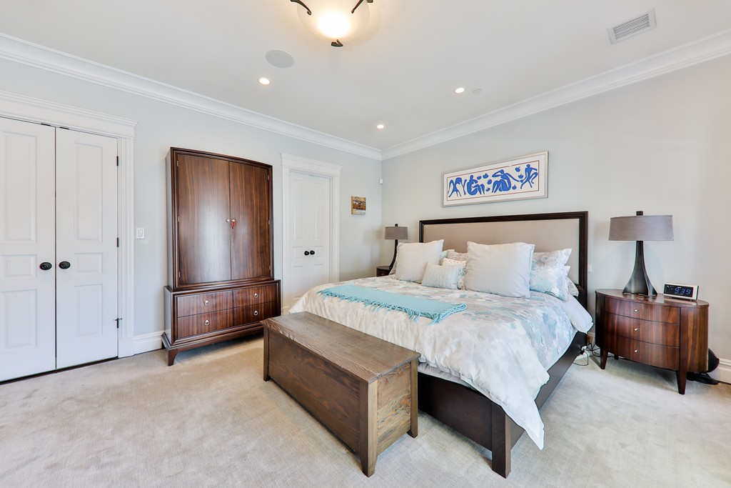 161 Tudor Street, Unit 4 Boston, MA 02127 - Photo 14 of 28 a spacious bedroom with a bed and a table