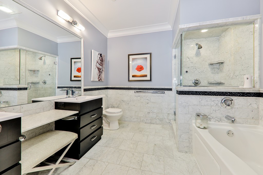 161 Tudor Street, Unit 4 Boston, MA 02127 - Photo 16 of 28 a bathroom with a sink a toilet and a bathtub