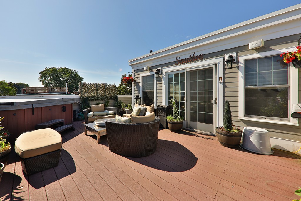 161 Tudor Street, Unit 4 Boston, MA 02127 - Photo 21 of 28 a view of a patio with couches and potted plants