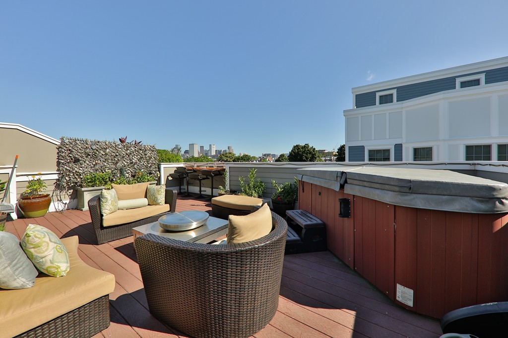 161 Tudor Street, Unit 4 Boston, MA 02127 - Photo 23 of 28 a living room with furniture and a fireplace