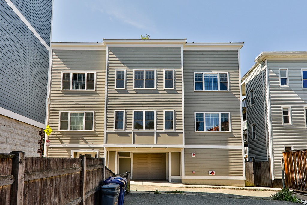 161 Tudor Street, Unit 4 Boston, MA 02127 - Photo 27 of 28 a front view of a building with a street