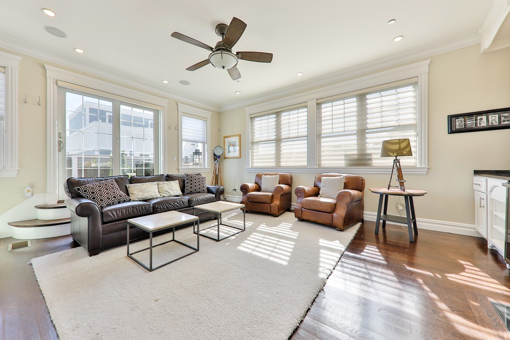 161 Tudor Street, Unit 4 Boston, MA 02127 - Photo 4 of 28 a living room with furniture and a large window