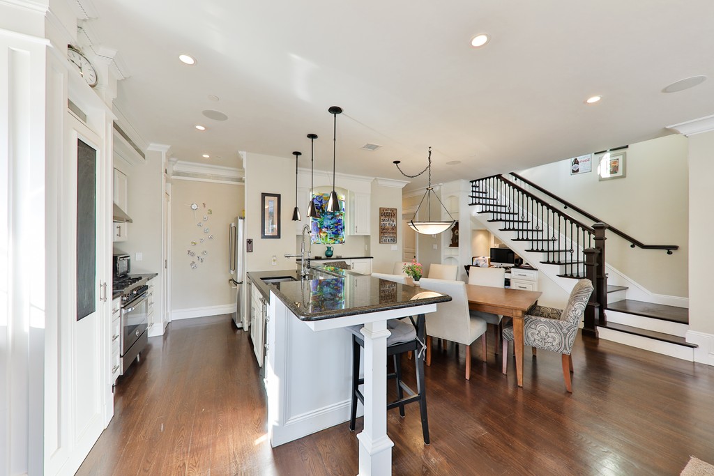 161 Tudor Street, Unit 4 Boston, MA 02127 - Photo 8 of 28 a large kitchen with a table and chairs