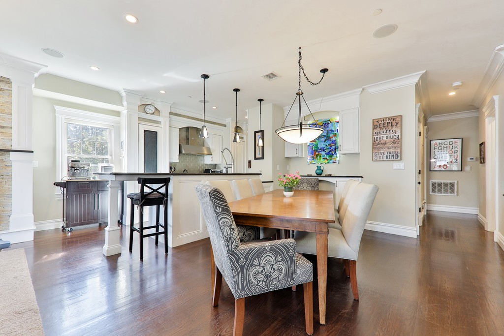 161 Tudor Street, Unit 4 Boston, MA 02127 - Photo 9 of 28 a dining room with furniture and wooden floor