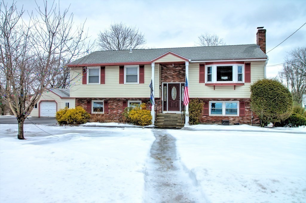 143 North Road Chelmsford, MA 01824 - Photo 1 of 42 a front view of a house with a yard