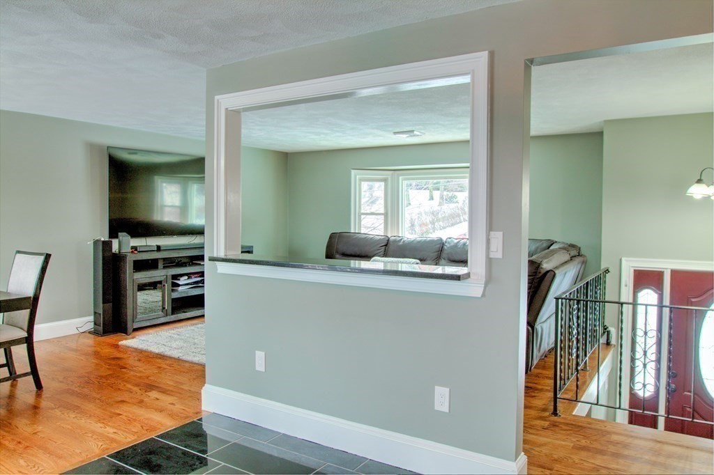 143 North Road Chelmsford, MA 01824 - Photo 11 of 42 a living room with furniture and a flat screen tv