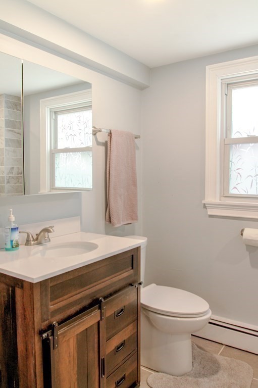 143 North Road Chelmsford, MA 01824 - Photo 13 of 42 a bathroom with a sink a toilet and a window