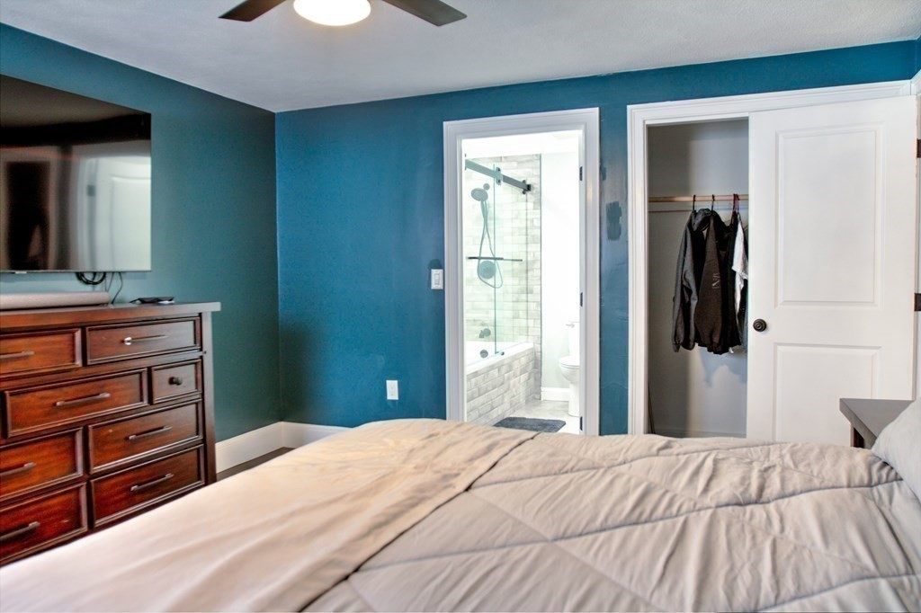 143 North Road Chelmsford, MA 01824 - Photo 14 of 42 a bedroom with a bed and a dresser