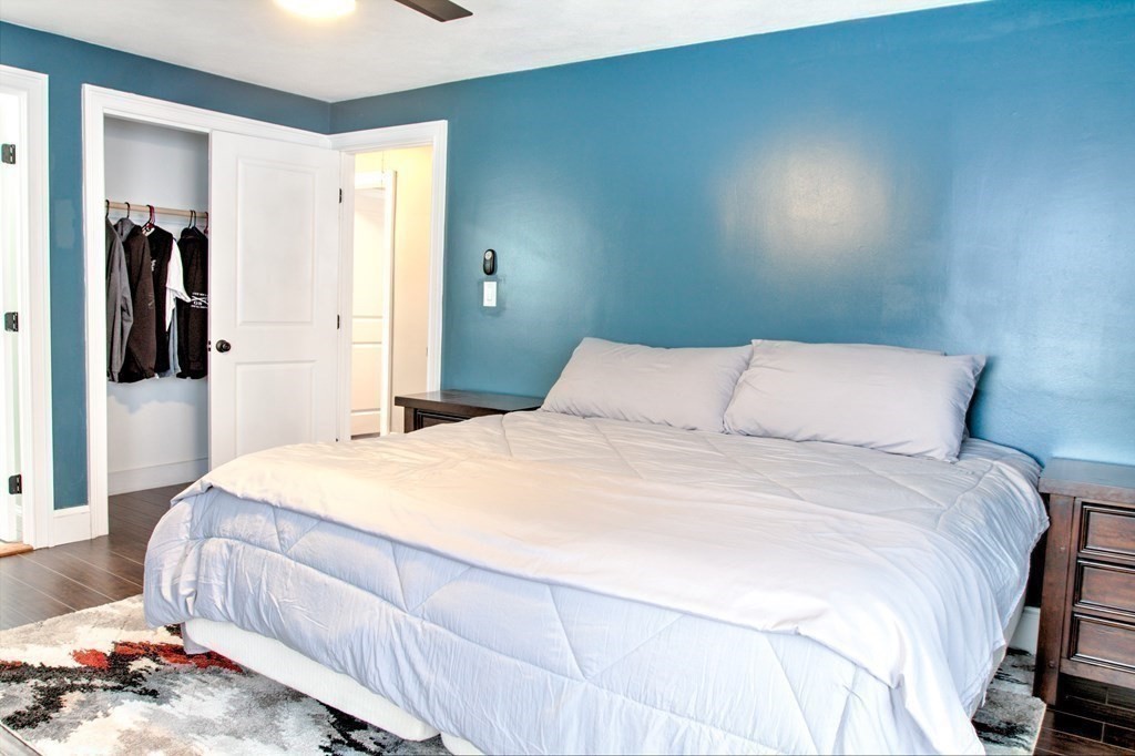 143 North Road Chelmsford, MA 01824 - Photo 15 of 42 a bedroom with a bed and mirror