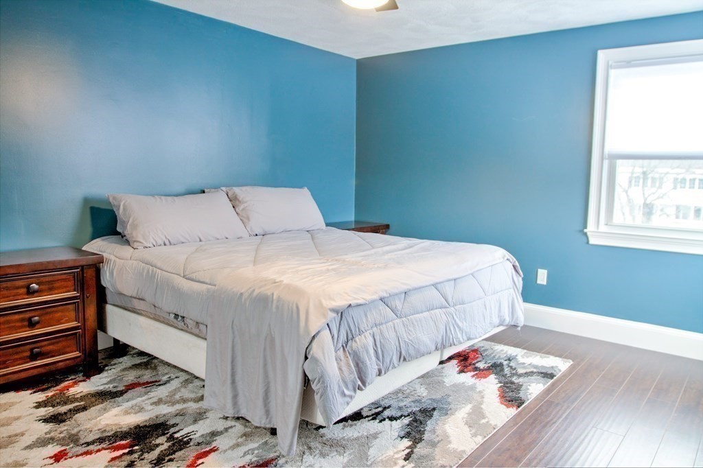 143 North Road Chelmsford, MA 01824 - Photo 16 of 42 a bedroom with a bed and a dresser