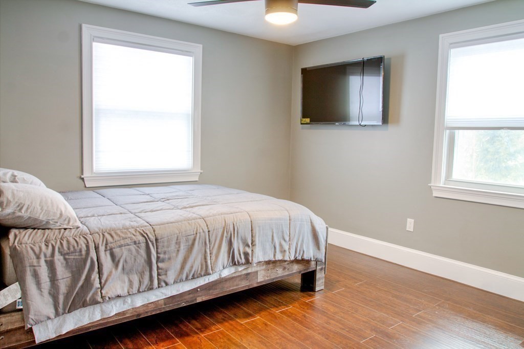 143 North Road Chelmsford, MA 01824 - Photo 18 of 42 a bed sitting in a bedroom next to a window