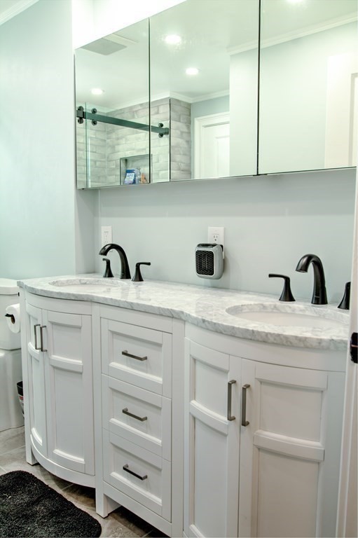 143 North Road Chelmsford, MA 01824 - Photo 22 of 42 a kitchen with white cabinets and sink