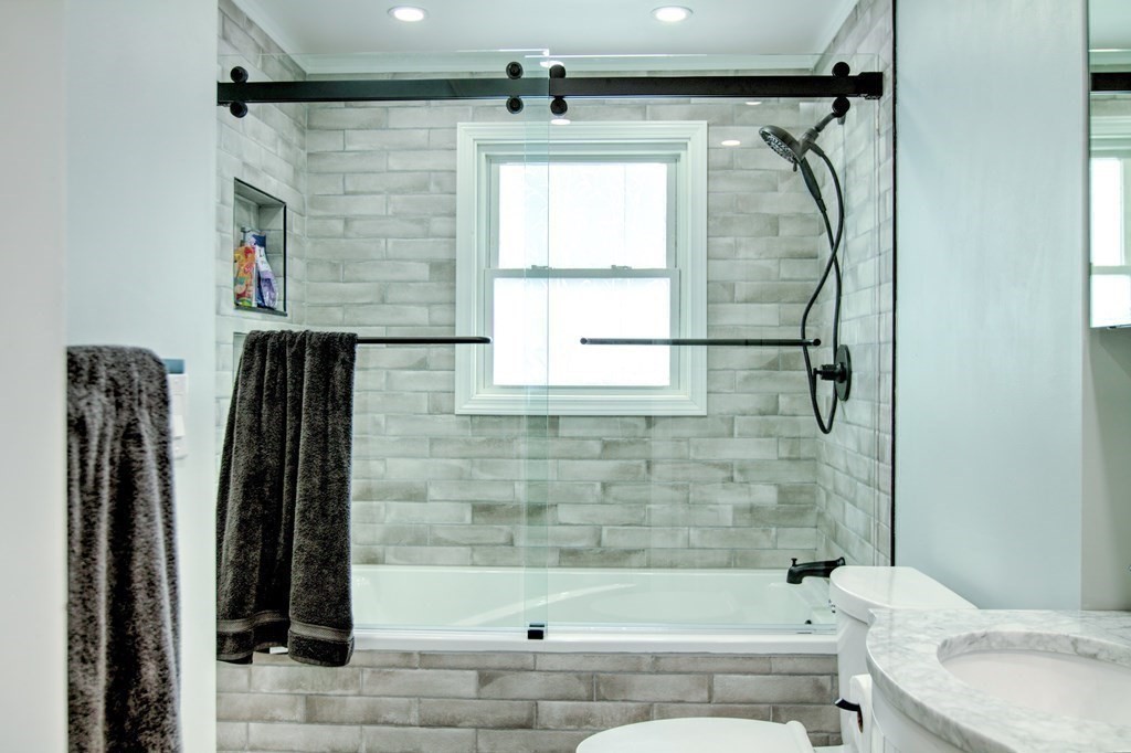 143 North Road Chelmsford, MA 01824 - Photo 23 of 42 a bathroom with a bathtub and a shower