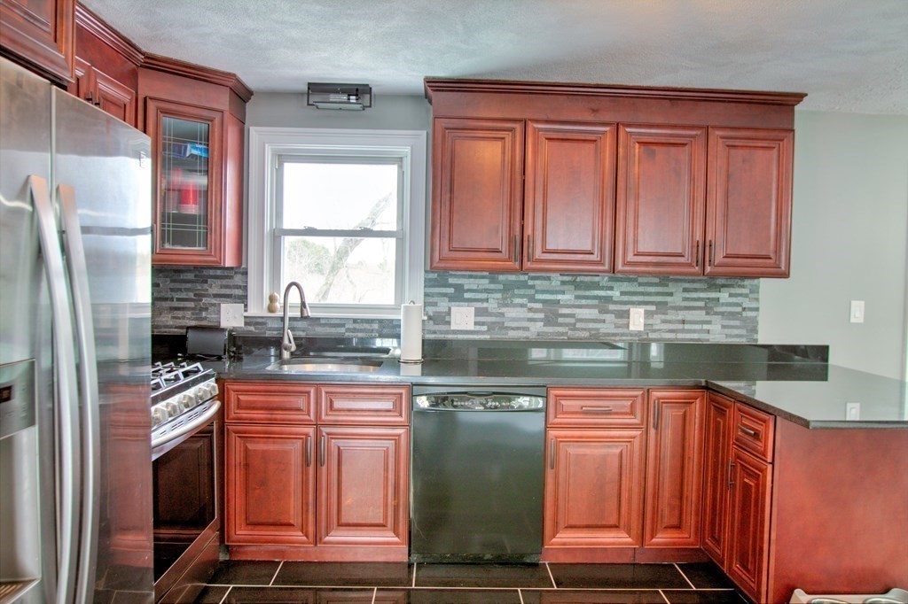 143 North Road Chelmsford, MA 01824 - Photo 3 of 42 a kitchen with stainless steel appliances granite countertop a stove a sink dishwasher and a refrigerator