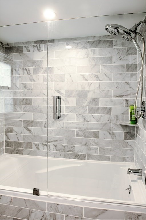 143 North Road Chelmsford, MA 01824 - Photo 31 of 42 a bathroom with a bathtub and a shower