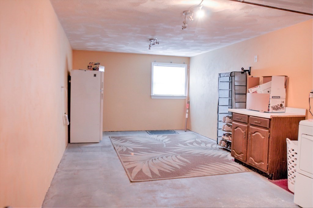 143 North Road Chelmsford, MA 01824 - Photo 32 of 42 an empty room with cabinet and mirror