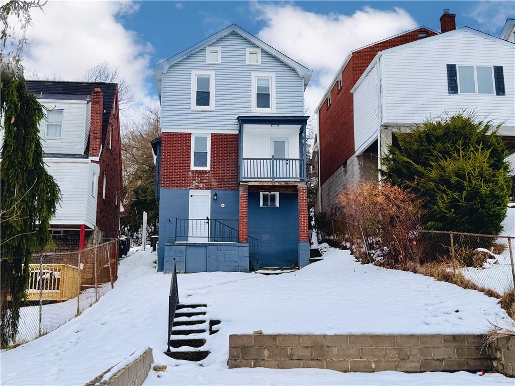 1037 Bay Ridge Avenue Pittsburgh, PA 15226 - Photo 2 of 34 a front view of a house with a yard