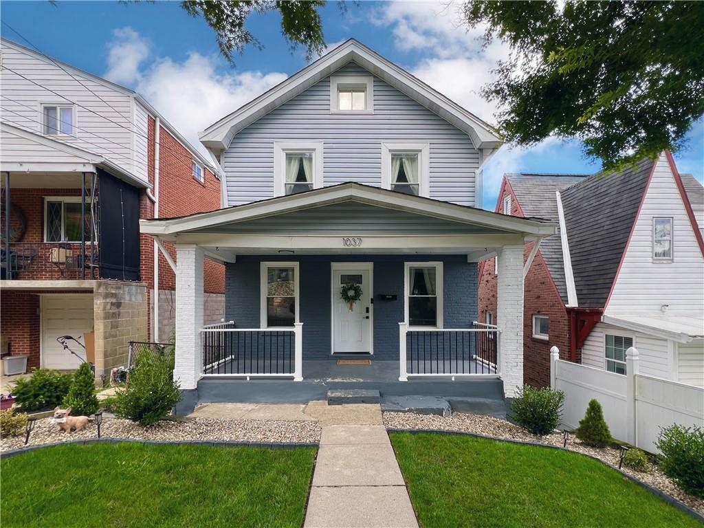 1037 Bay Ridge Avenue Pittsburgh, PA 15226 - Photo 29 of 34 a front view of a house with a yard and potted plants