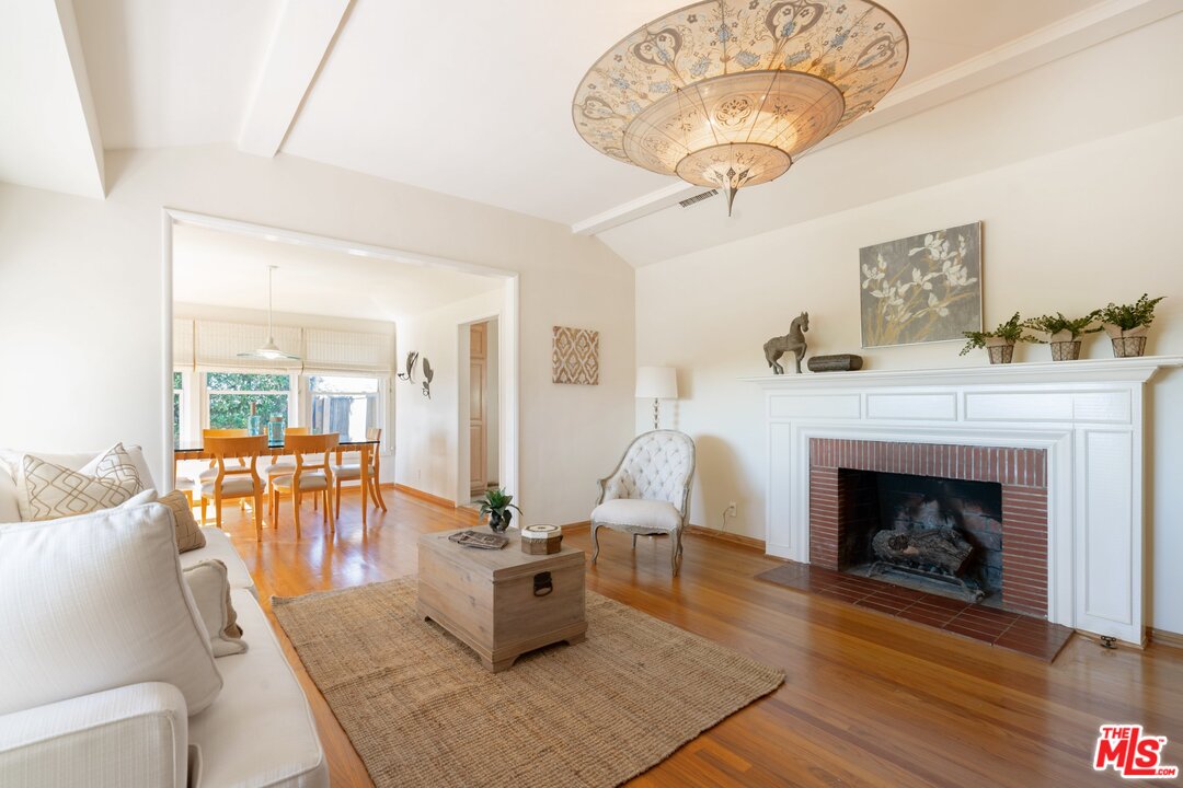 3710 Eureka Drive Studio City, CA 91604 - Photo 20 of 51 a living room with furniture and a fireplace