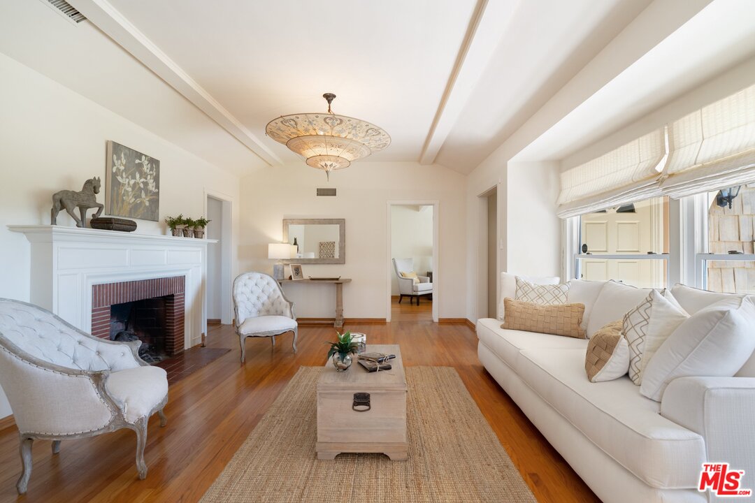 3710 Eureka Drive Studio City, CA 91604 - Photo 21 of 51 a living room with furniture and a fireplace