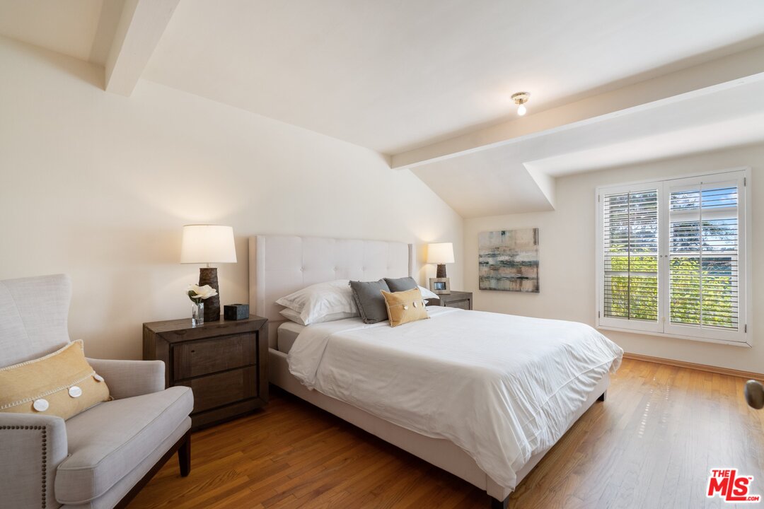 3710 Eureka Drive Studio City, CA 91604 - Photo 22 of 51 a bedroom with a bed and a couch