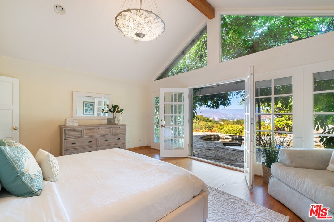 3710 Eureka Drive Studio City, CA 91604 - Photo 41 of 51 a bed room with a bed and a large window