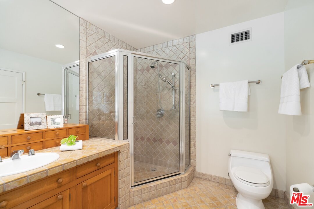 3710 Eureka Drive Studio City, CA 91604 - Photo 45 of 51 a bathroom with a double vanity sink toilet and shower