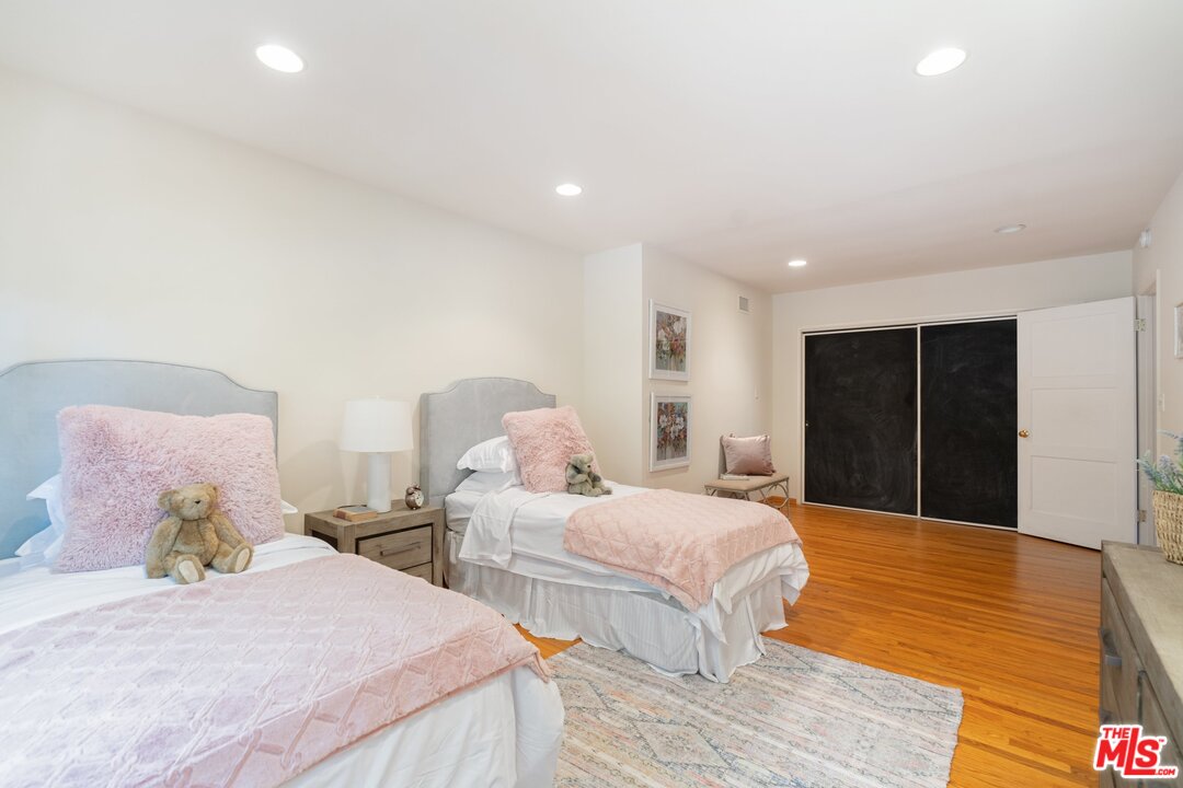 3710 Eureka Drive Studio City, CA 91604 - Photo 49 of 51 a bedroom with two beds and a walk in closet